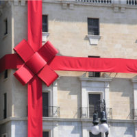 inherited property concept shown as house with wrapped bow