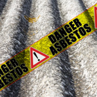 Yellow tape that reads danger Asbestos.jpg.crdownload