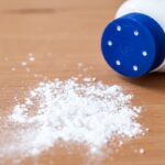 Talcum powder on wooden background