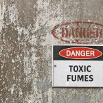 red, black and white Danger, Toxic Fumes warning sign